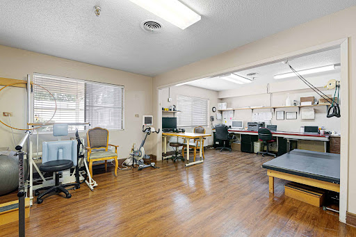 A spacious medical office designed for physical therapy and rehabilitation.