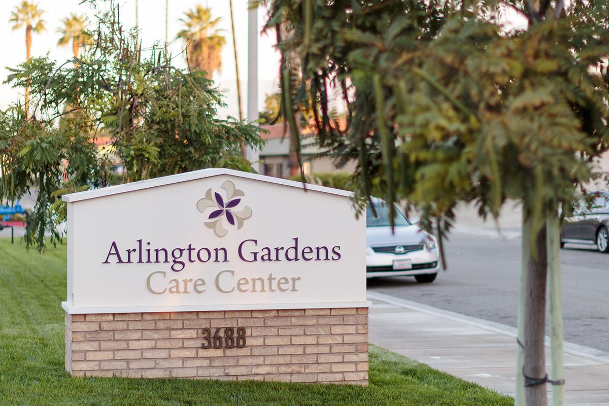 The entrance sign for Arlington Gardens Care Center.