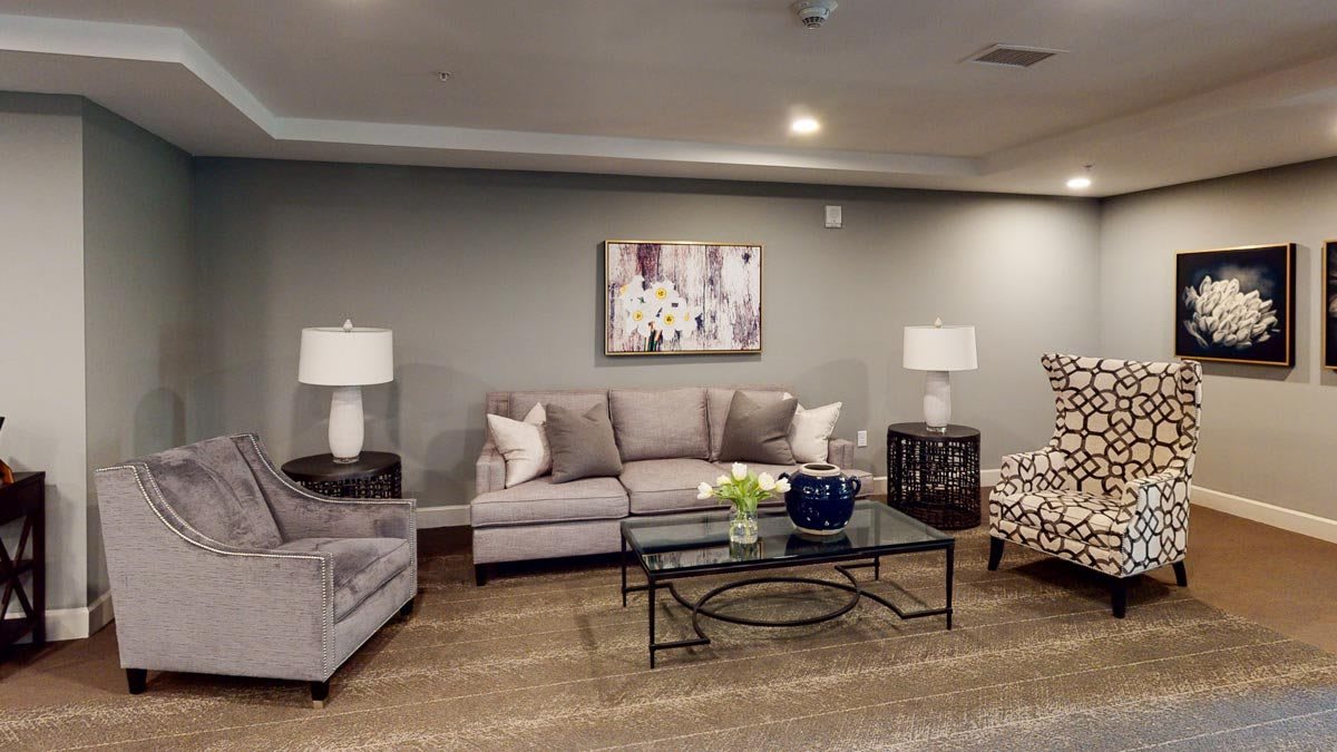 A modern living room with a comfortable sofa, coffee table, and stylish decor.