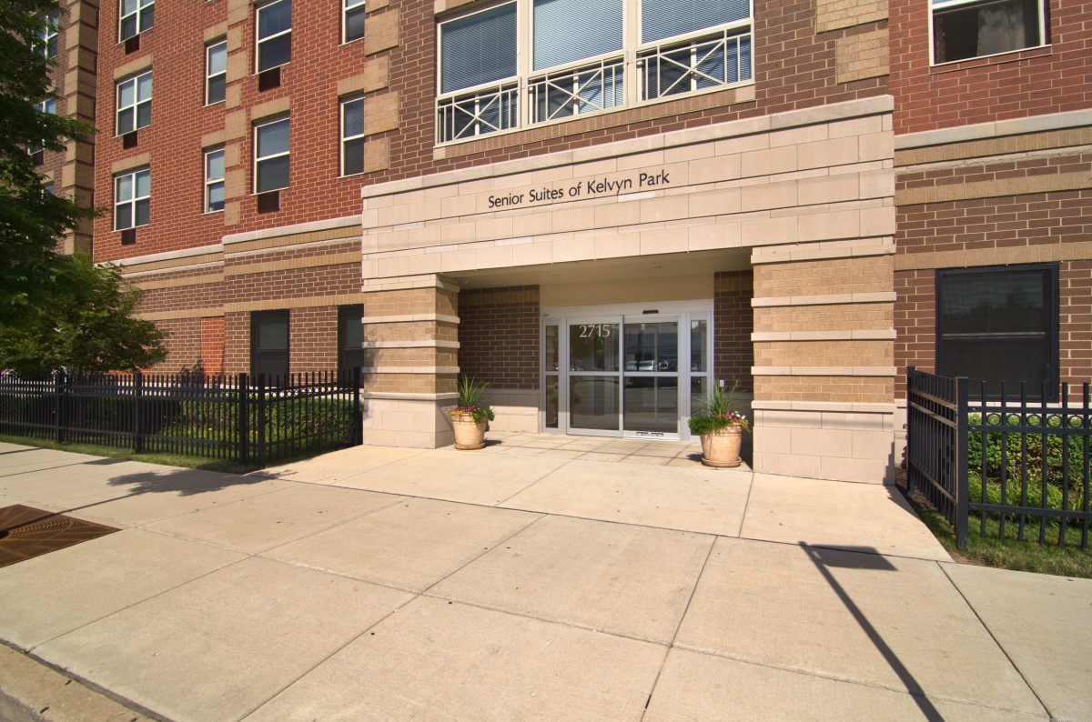 The front entrance of a multi-story residential building.