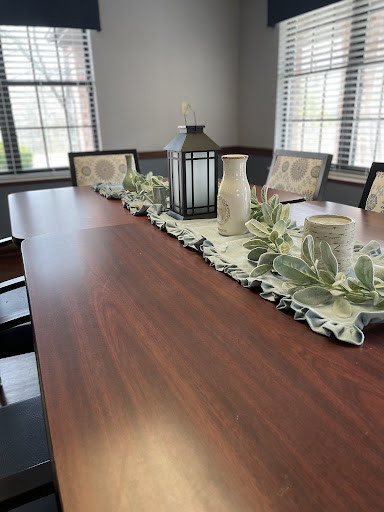 A beautifully arranged dining table featuring decorative elements and a cozy atmosphere.