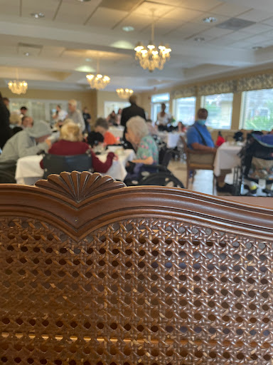 A bustling dining area filled with people enjoying their meals and socializing.