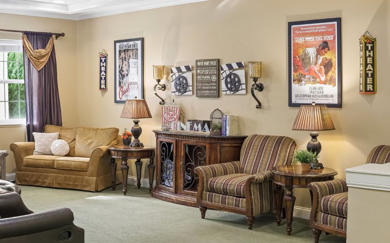 A cozy living room with comfortable seating and stylish wall decor.