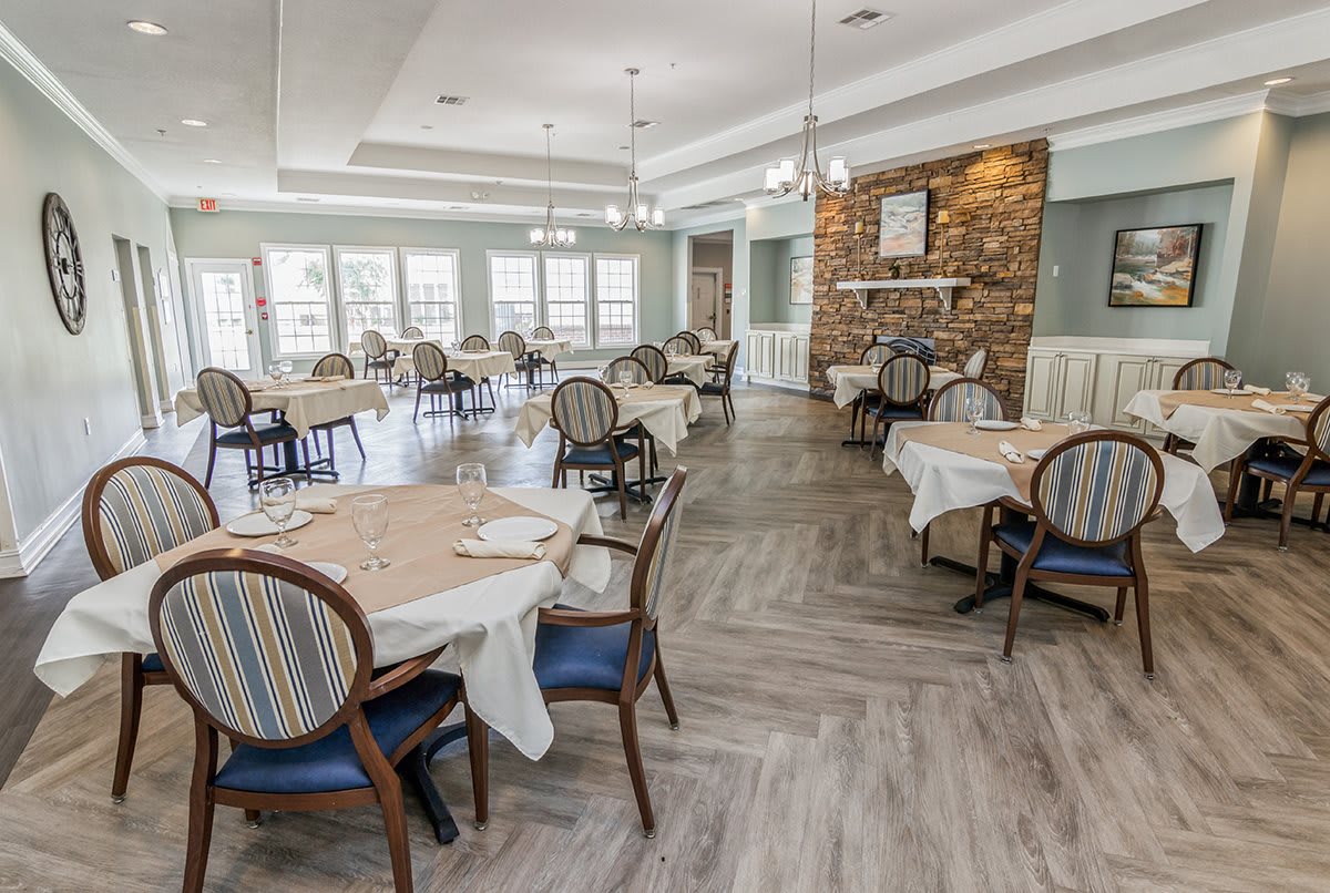 Elegant restaurant dining room with neatly arranged tables and chairs.