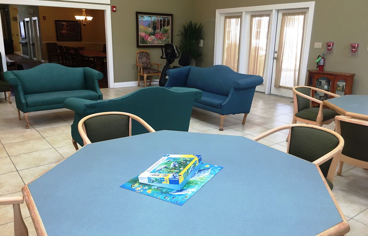 A cozy living room with comfortable seating and a coffee table.