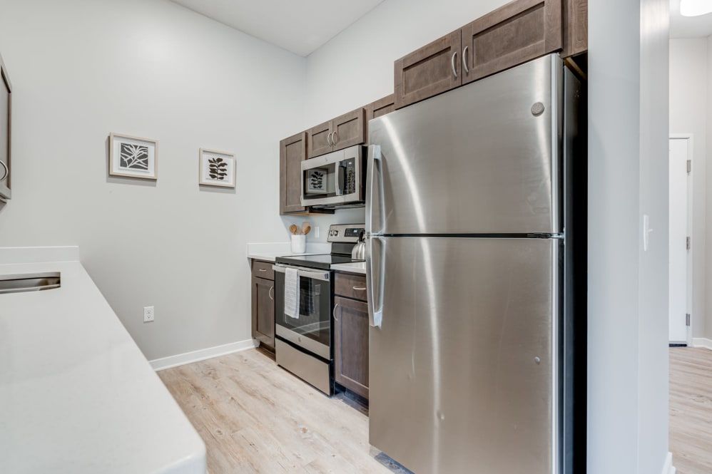 A modern kitchen featuring stainless steel appliances and sleek cabinets.