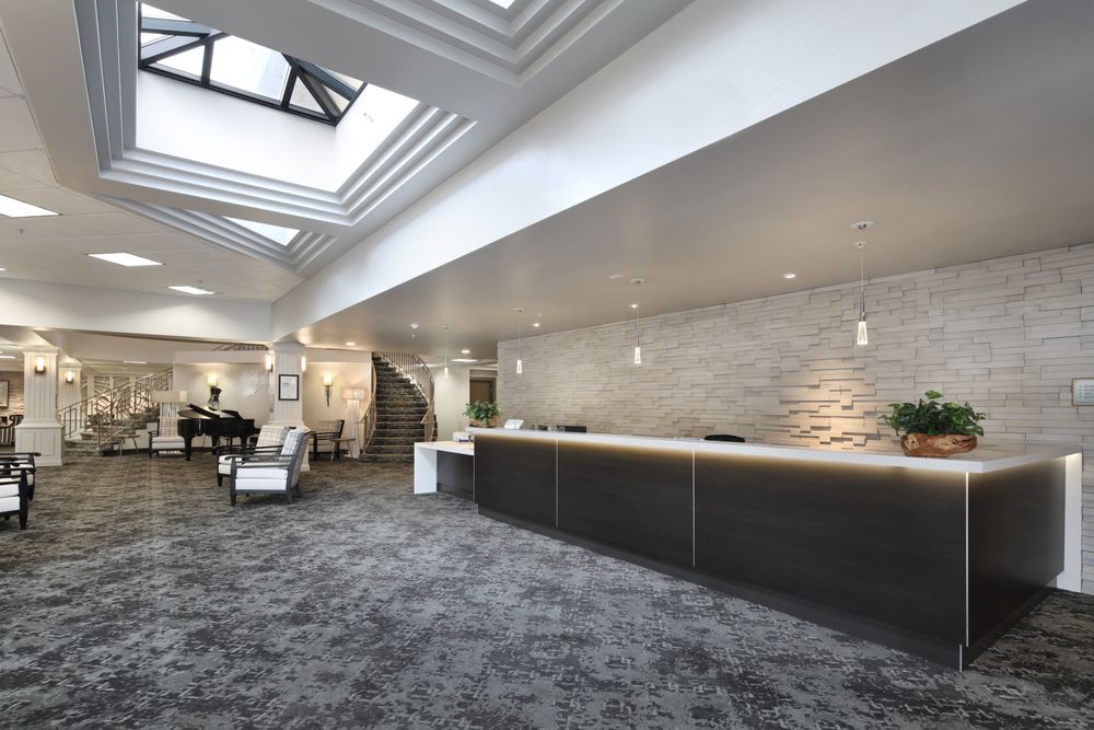 A modern lobby with a sleek reception desk and stylish decor.
