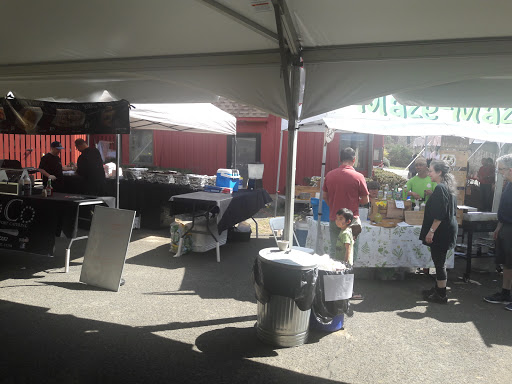 Vendors setting up their stalls at an outdoor market.