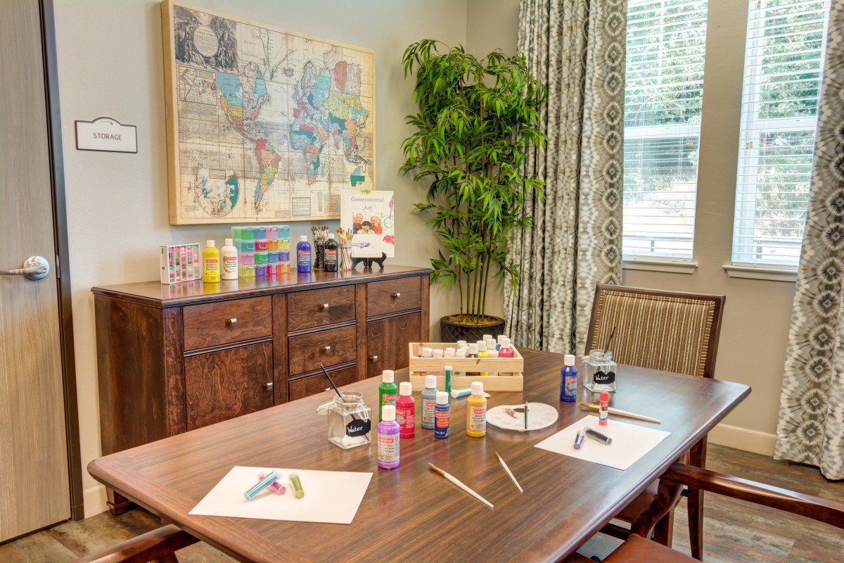 A cozy art and craft room with paint supplies ready for a creative session.