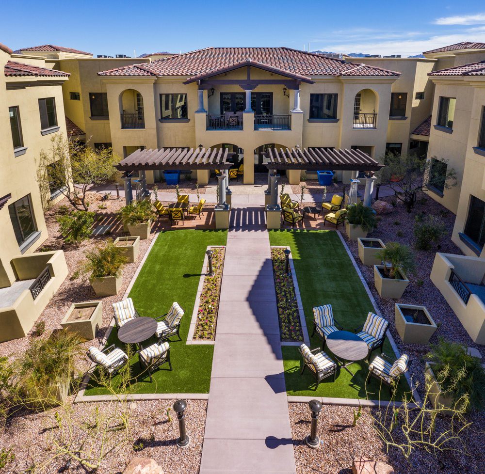 Aerial view of a landscaped courtyard with pathways and seating areas.