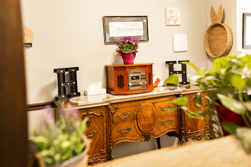 A charming vintage setup featuring an antique radio and decorative elements.