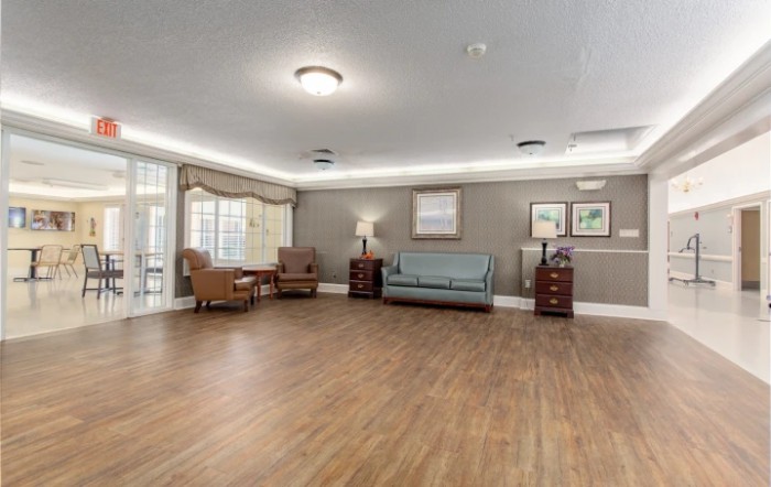 A spacious living room with comfortable seating and elegant decor.