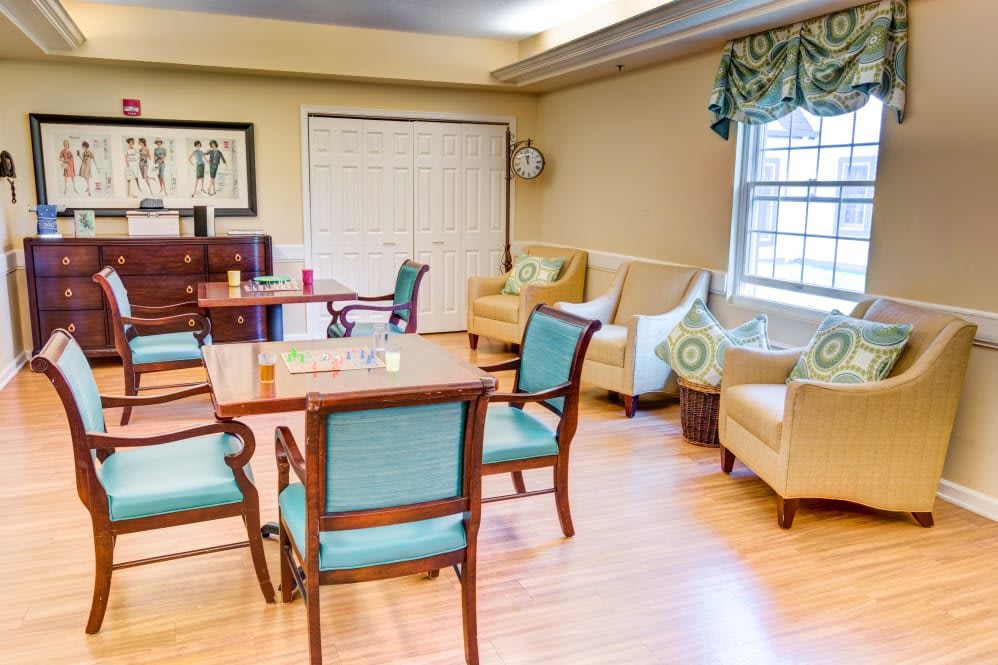 A cozy living room with comfortable seating and a wooden table.