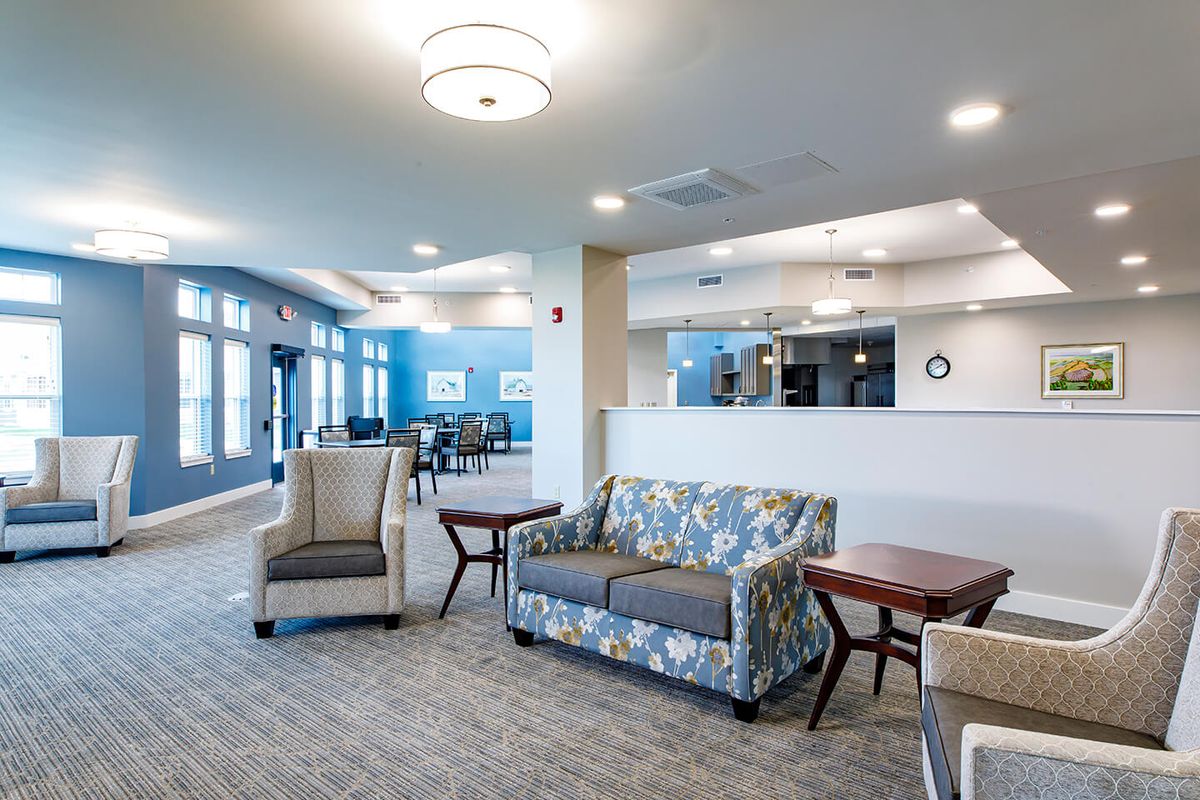 A modern lounge area with comfortable seating and elegant lighting.