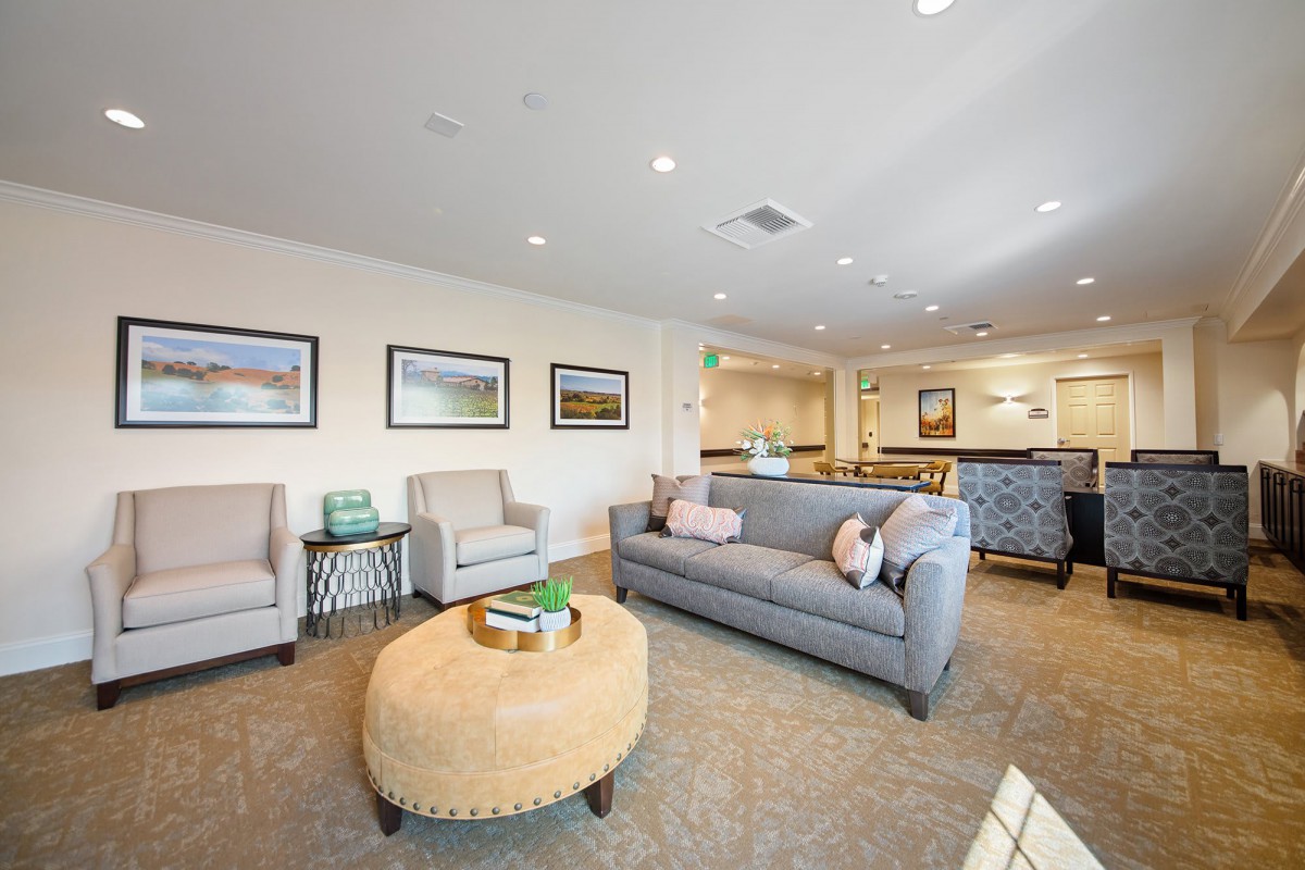 A spacious and stylish living room with comfortable seating and elegant decor.