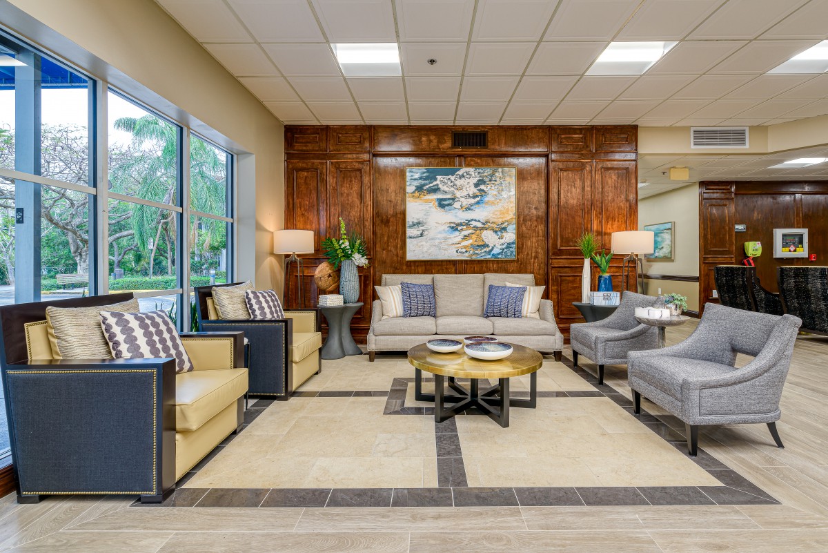 A modern living room with elegant furniture and decorative accents.
