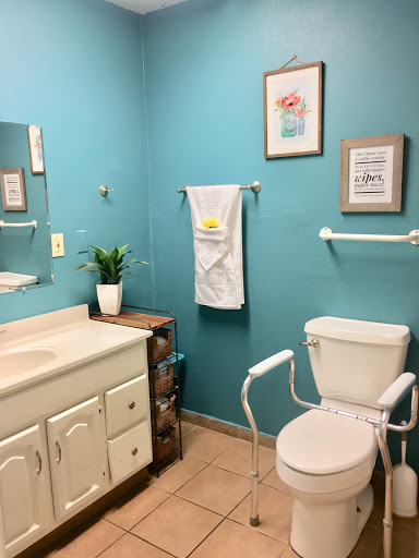 A bright and inviting bathroom with blue walls and modern fixtures.