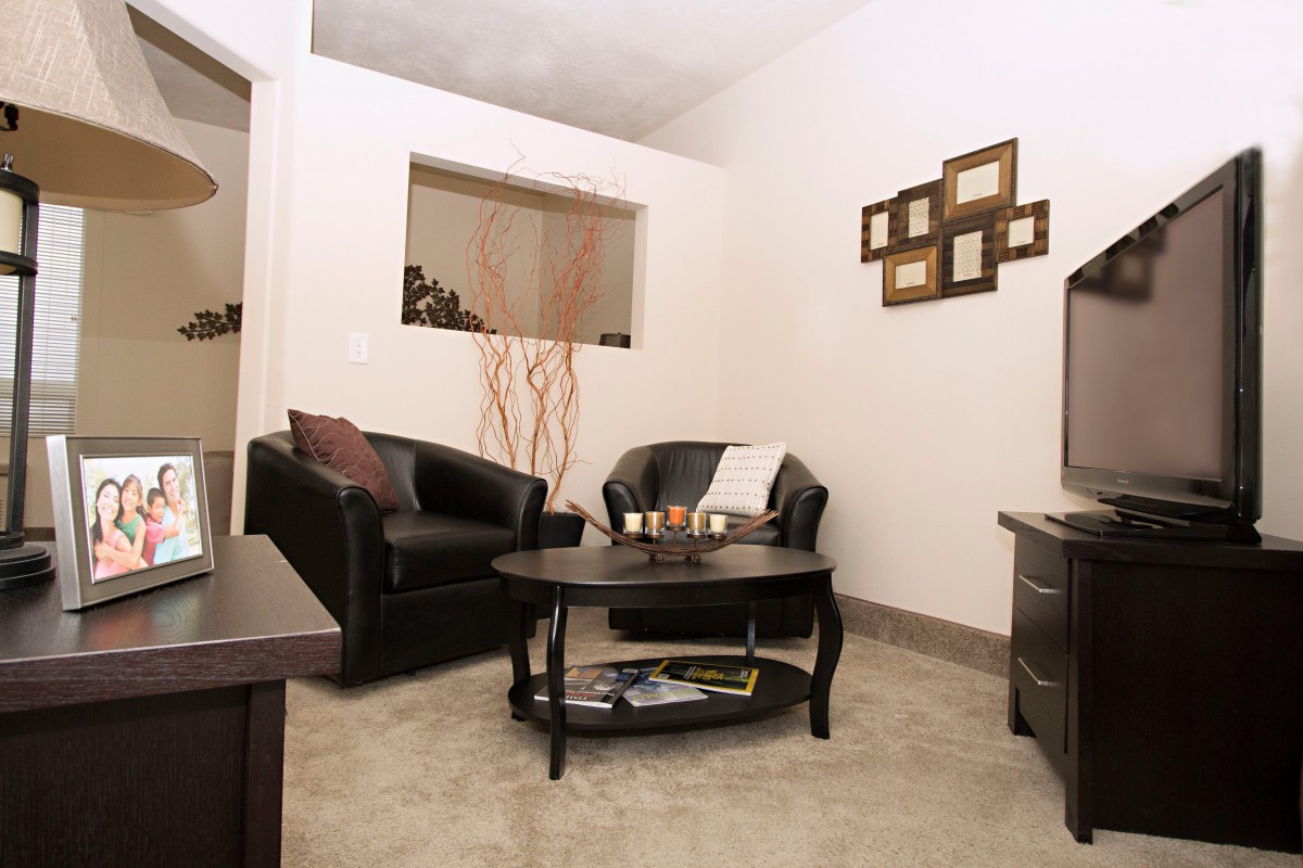 A modern living room with comfortable seating and stylish decor.