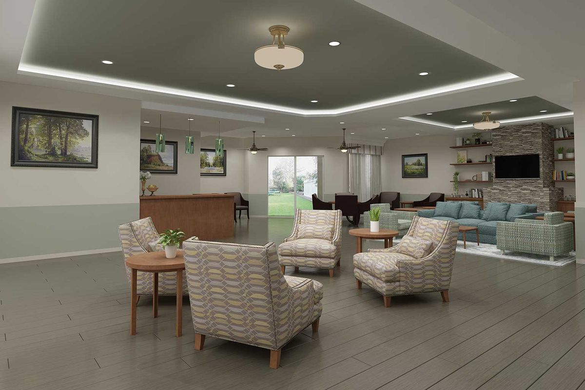 A modern lounge area featuring comfortable chairs, wood flooring, and elegant lighting.