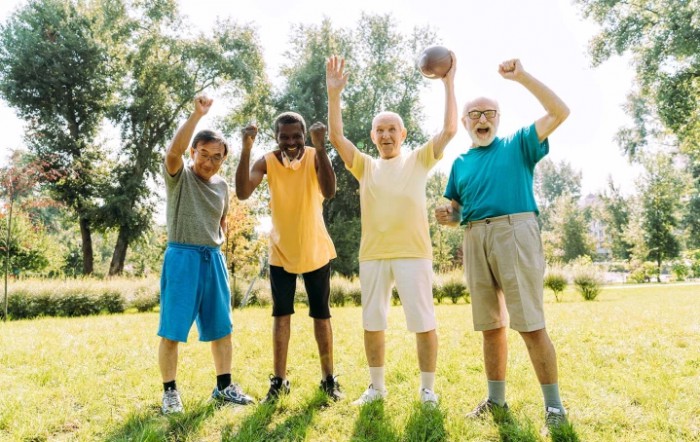 A group of senior men enjoying an outdoor sports activity together.