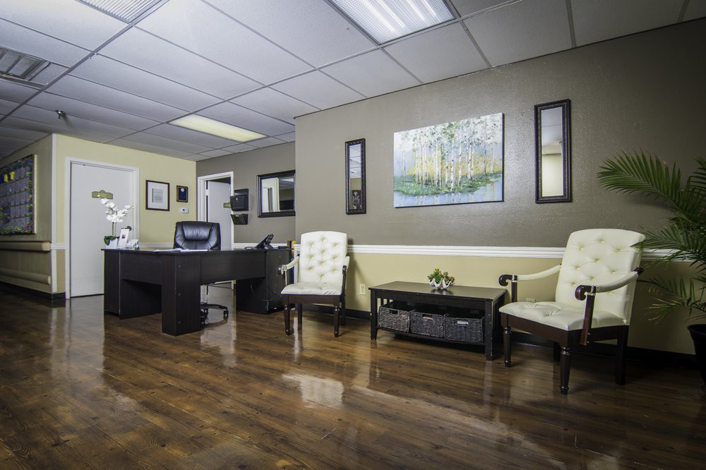 A well-organized office waiting room with comfortable seating and tasteful decor.