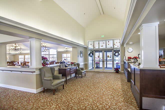 A spacious lobby with comfortable seating and natural lighting.