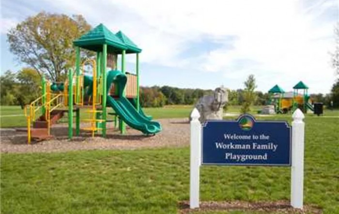 A sunny day at the Wexham Family Playground featuring a green slide.