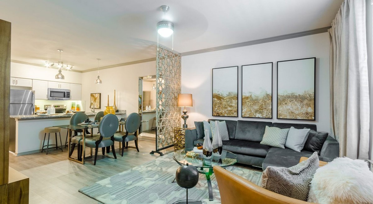 A modern living and dining space featuring stylish furniture and contemporary artwork.
