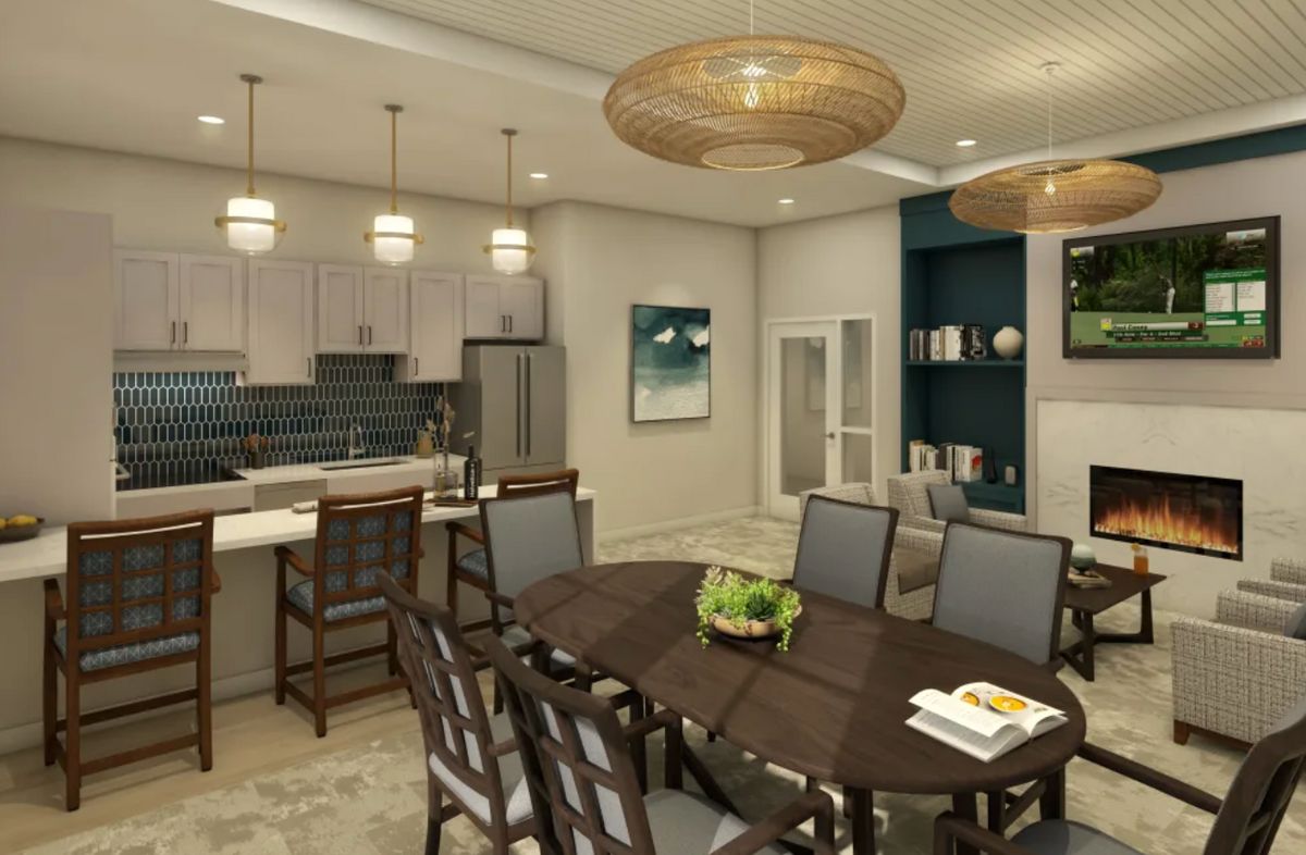 A modern open-concept kitchen and dining area with stylish wood furniture and pendant lighting.