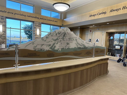 A beautifully designed lobby featuring a striking mountain sculpture as a centerpiece.