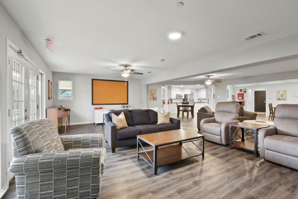 A modern living room with comfortable seating and a spacious open layout.