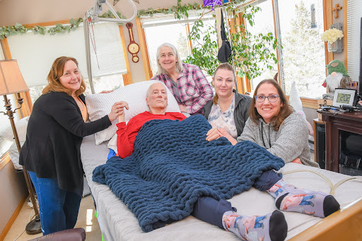 A heartfelt moment shared among family members, gathered together to support their loved one.