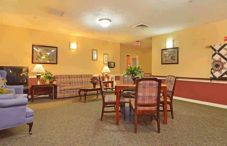 A cozy lobby with seating area and decor.