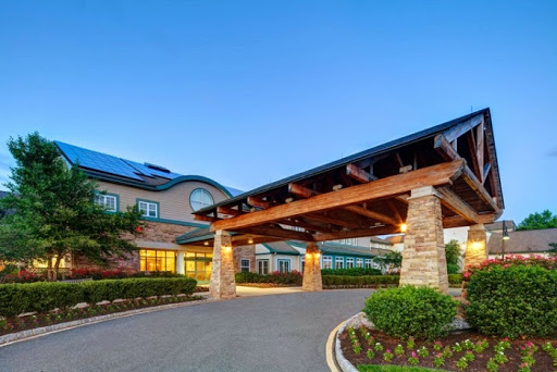 The entrance of a modern hotel showcasing elegant architectural design.