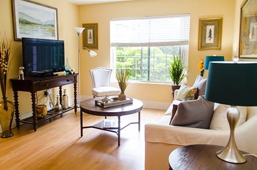 A bright and cozy living room with stylish furniture and vibrant decor.