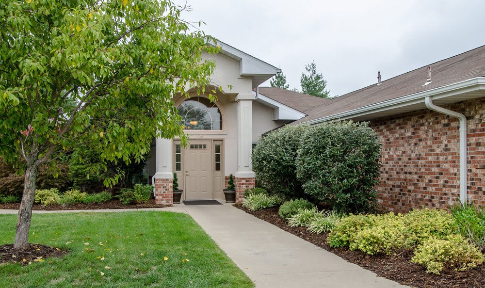 A welcoming house entrance with well-maintained landscaping.