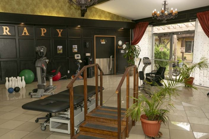 A well-equipped rehabilitation center featuring exercise machines and therapy facilities.