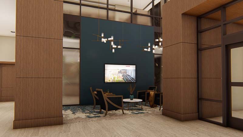 A modern lobby interior with sleek furniture, stylish lighting, and a feature wall.