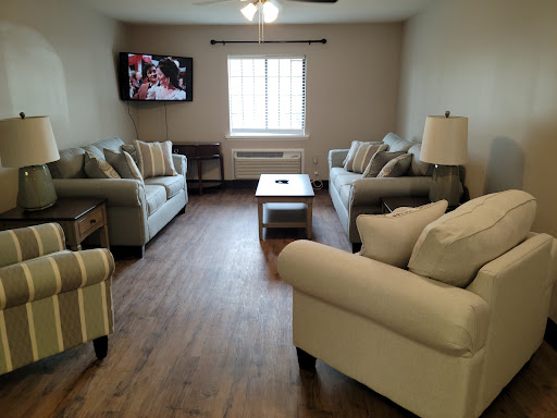 A cozy living room with comfortable seating and natural light.