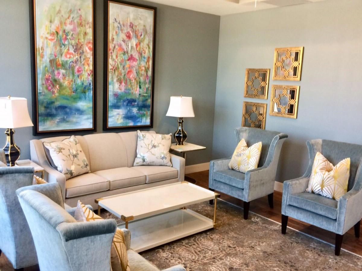 A beautifully decorated living room featuring comfortable seating and tasteful artwork.