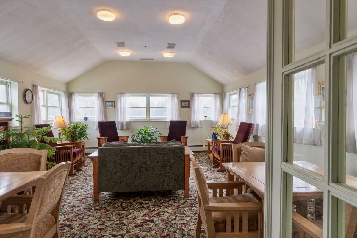 A cozy living room with comfortable seating and natural lighting.