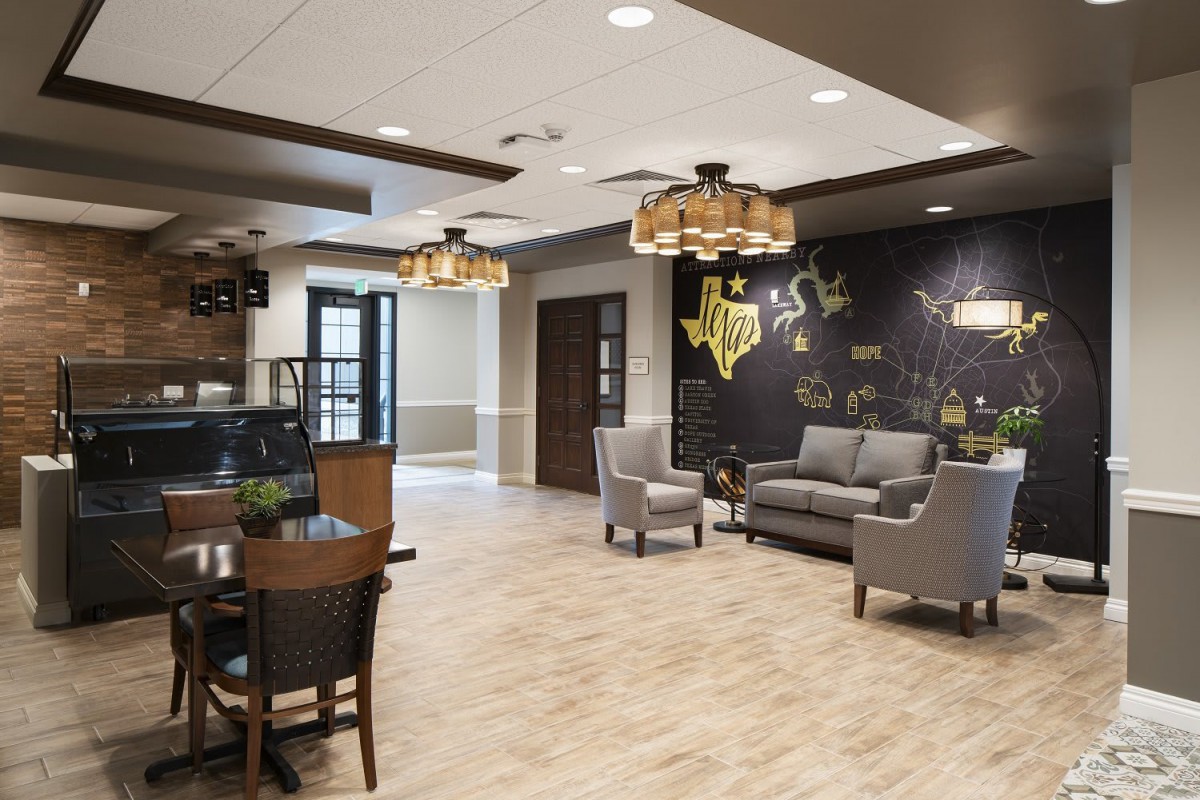 A modern lobby with comfortable seating and stylish lighting fixtures.