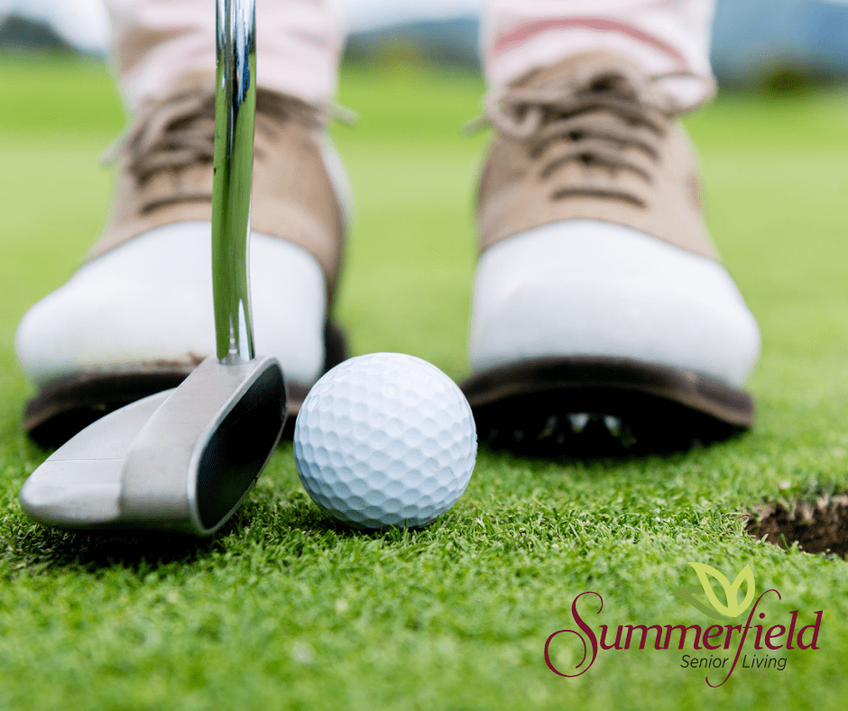 A close-up view of a golfer preparing to putt on the green.