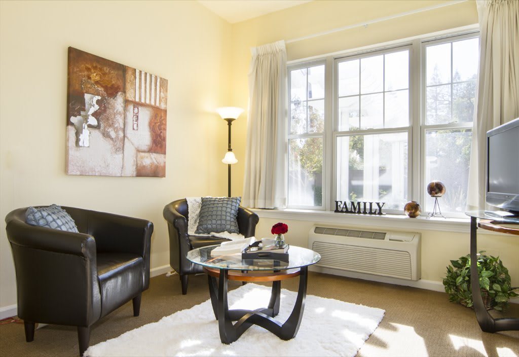 A cozy living room with modern furniture and bright natural lighting.