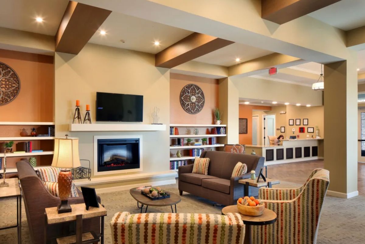 A cozy and modern living room with a fireplace and stylish furniture.