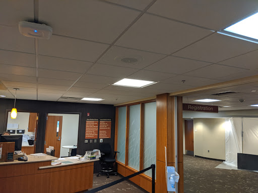 A view of a modern office reception area with contemporary design and lighting.