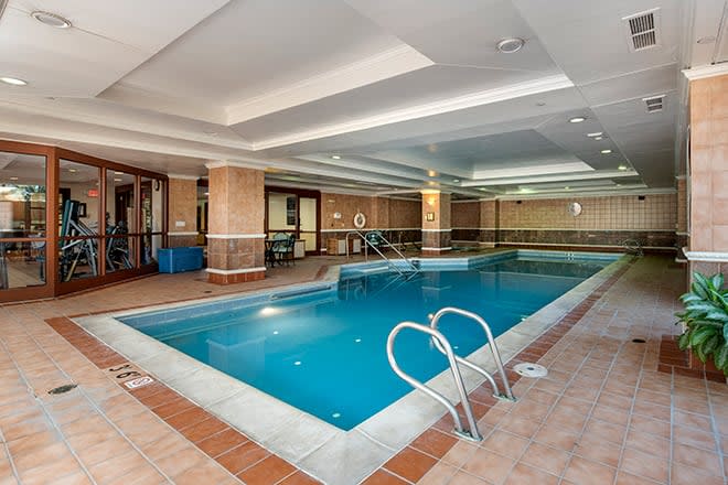 An inviting indoor swimming pool area designed for relaxation and leisure.