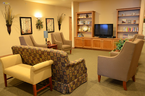 A cozy living room area featuring comfortable seating and a television.