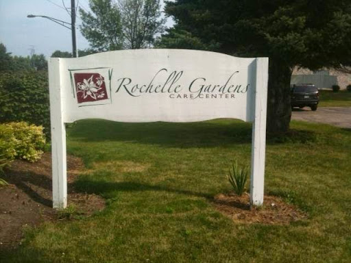 A welcoming sign for Rochelle Garden, a serene landscape area.