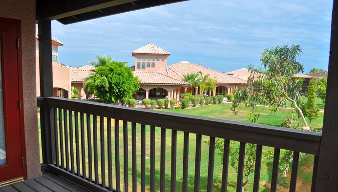 A luxurious house with a beautiful garden view from the patio.